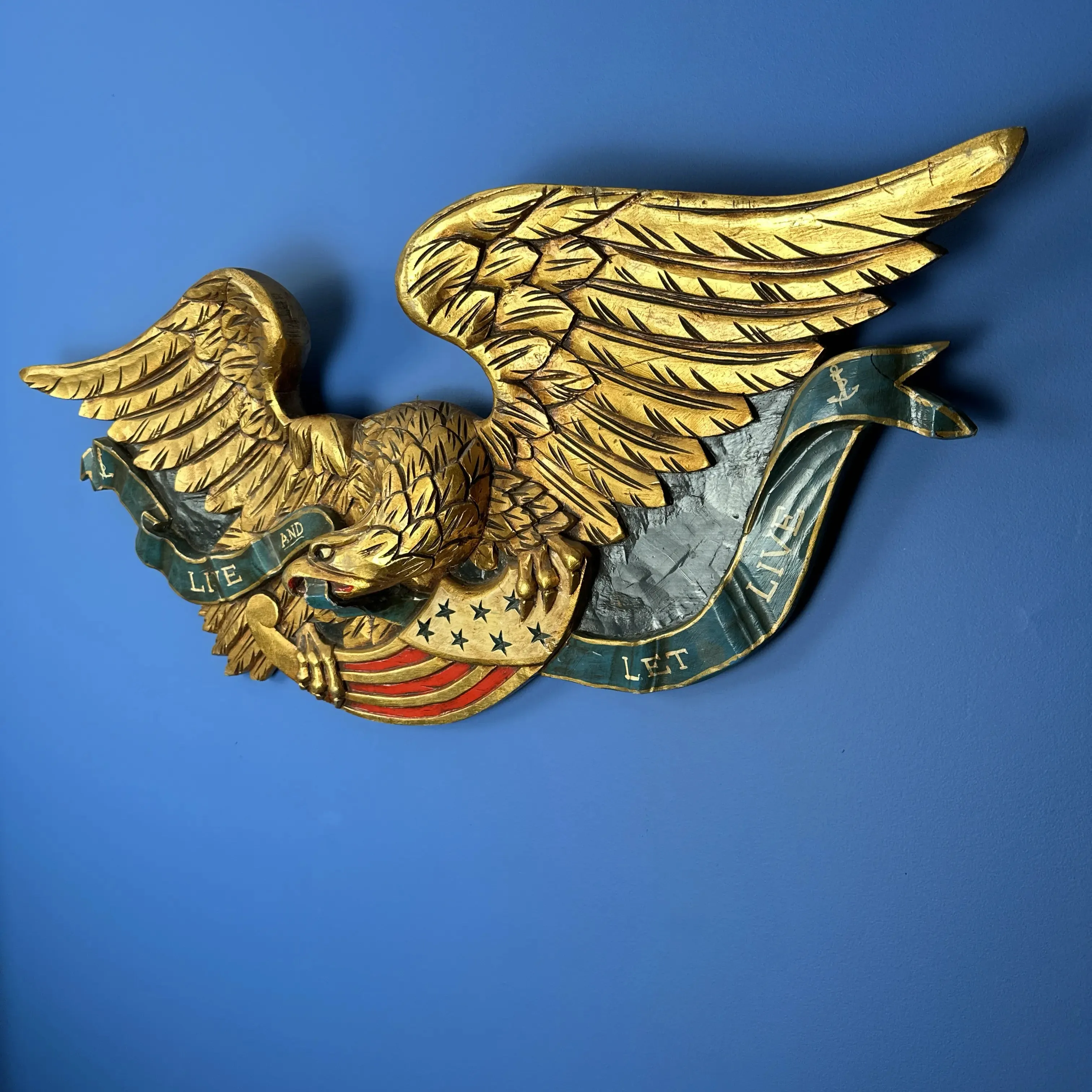 Carved wooden eagle — "Live and Let Live" — 36" wide